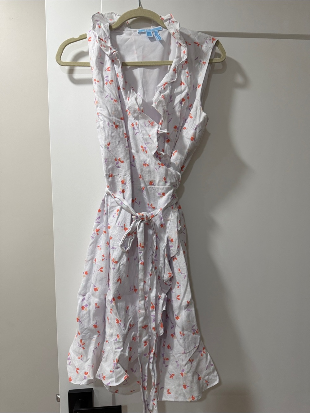 Sleeveless White Floral Wrap Dress with Ruffle Trim